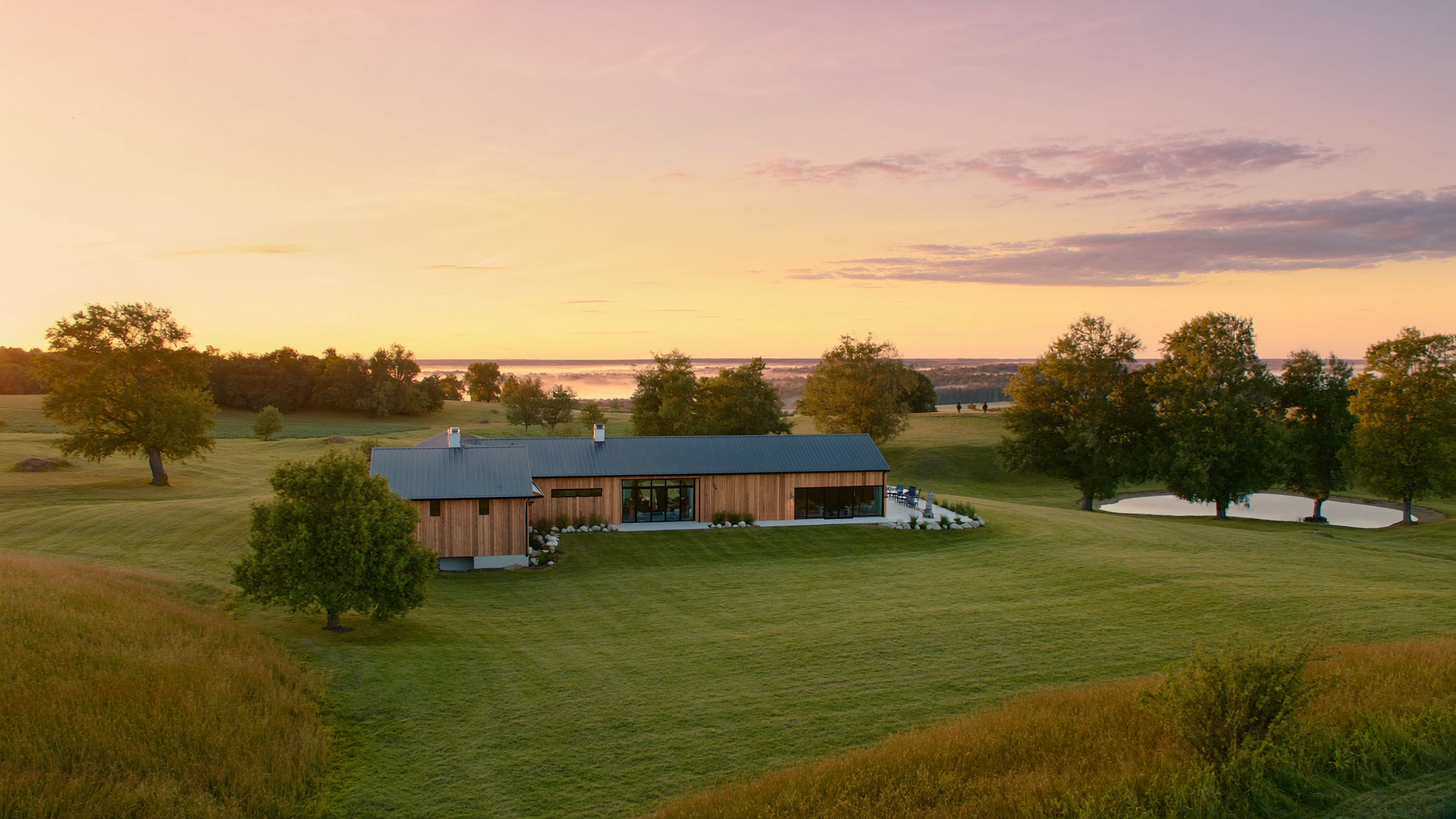 Custom rural Ontario farmhouse at golden-hour dusk