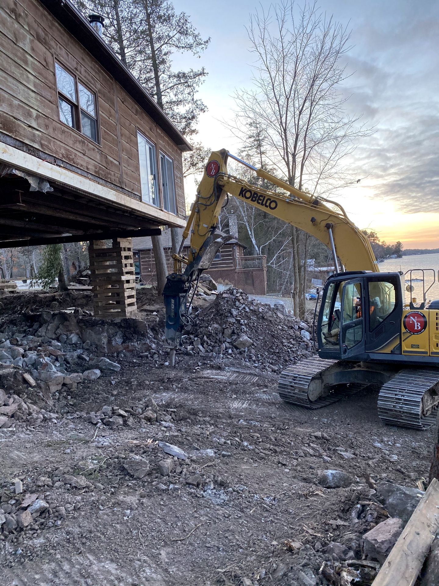 Breaking rock at a lakefront build site