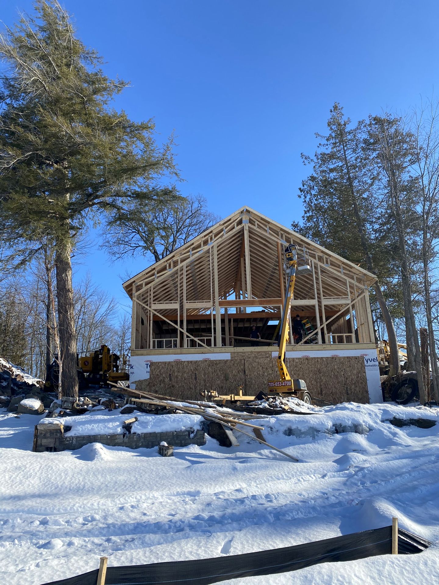 Roof structure going up on a Nicholson Bros build, mid-winter
