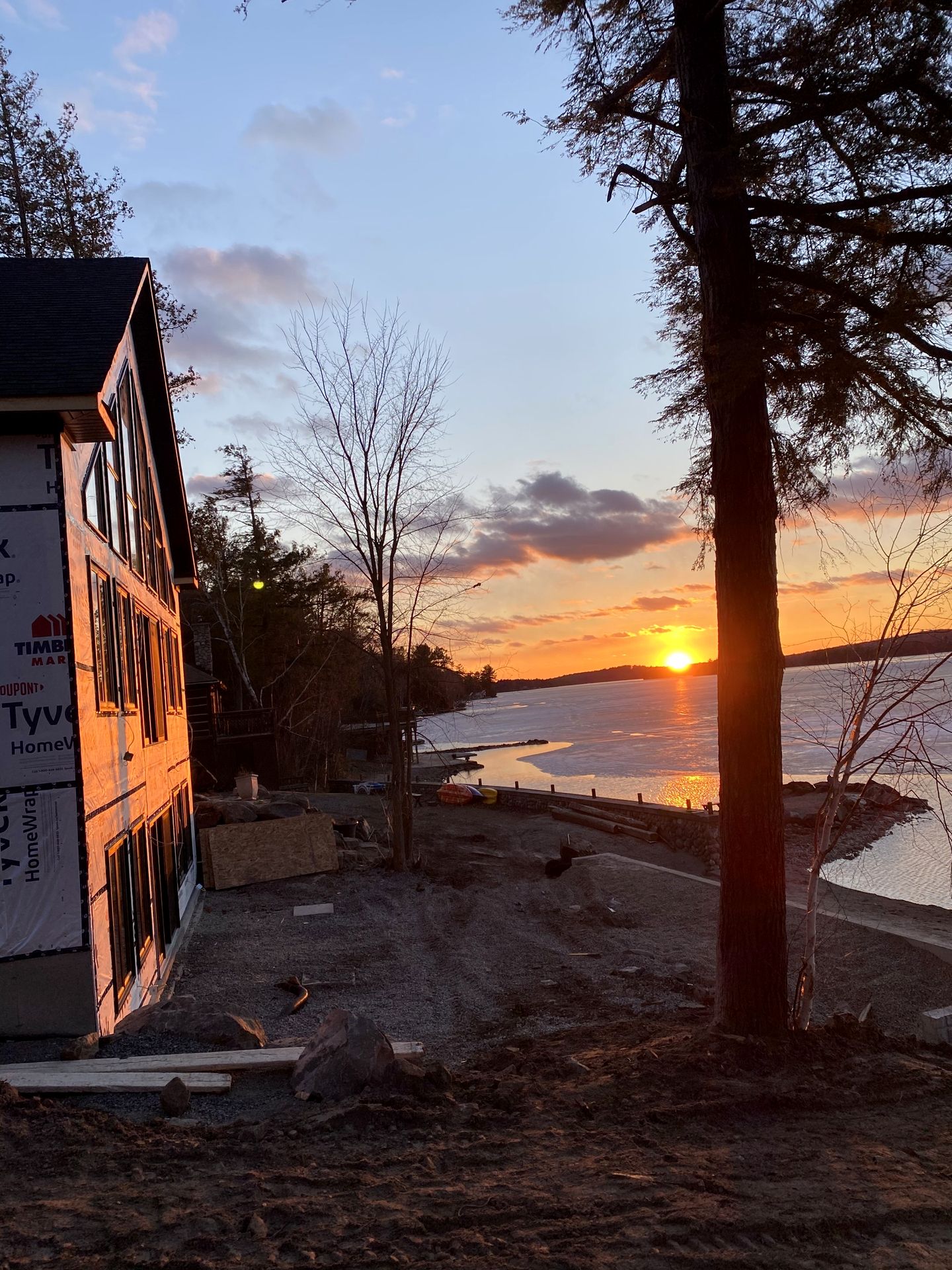 Sunset over the frozen lake from a Nicholson Bros build site