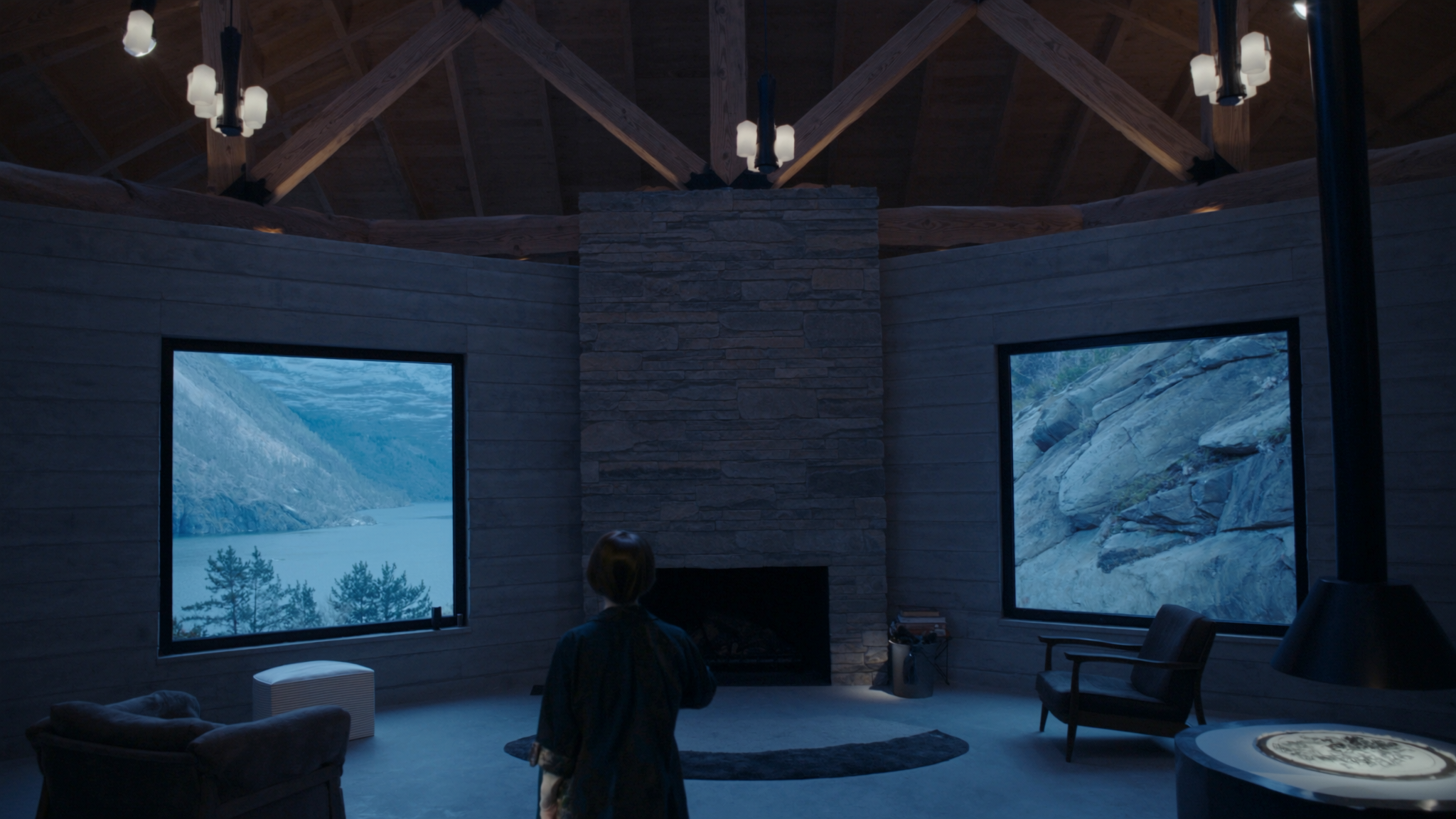 The Stoney Lake — timber-framed great room with stone fireplace and lake view